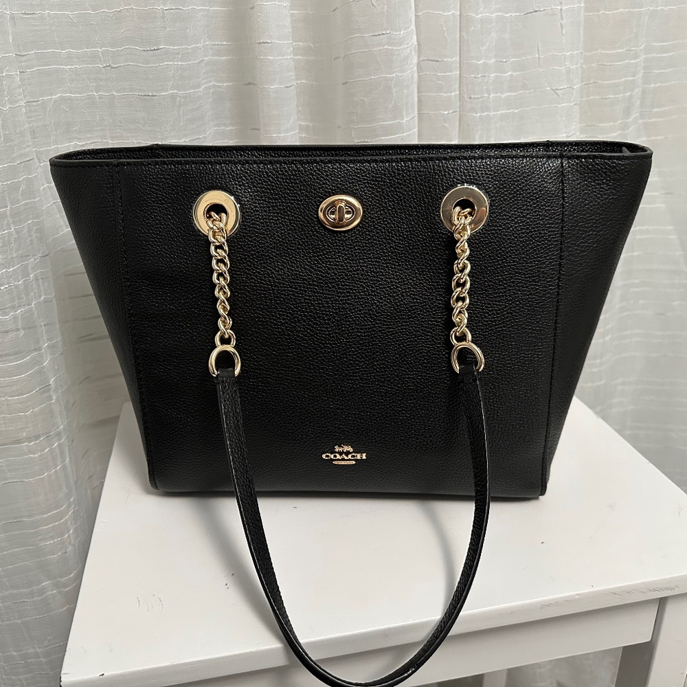 Brand new black COACH authentic turn lock handbag.
